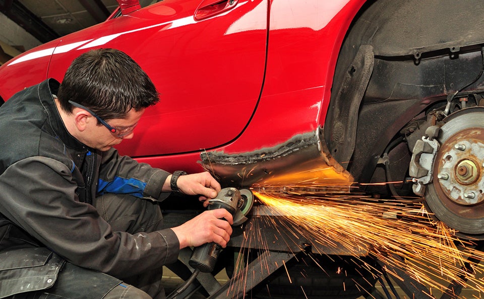 Service technician working on a vehicle - Minocqua Chevrolet in MINOCQUA WI