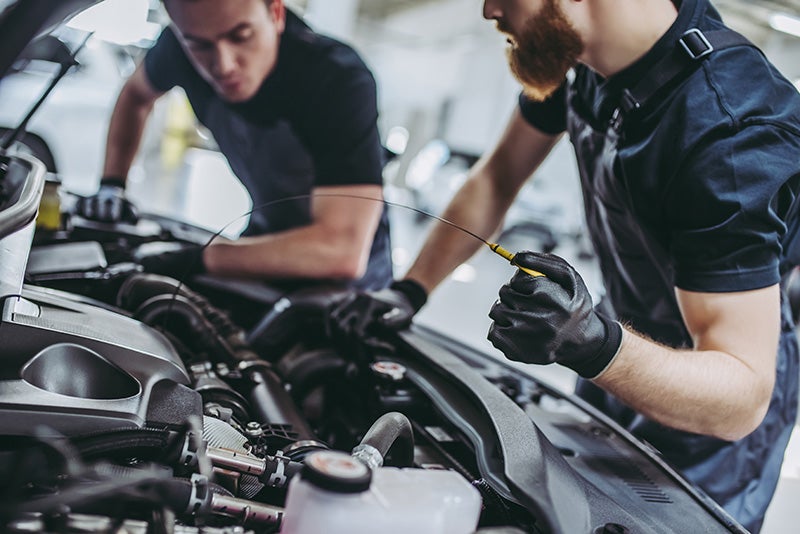 Service technician working on a vehicle - Minocqua Chevrolet in MINOCQUA WI